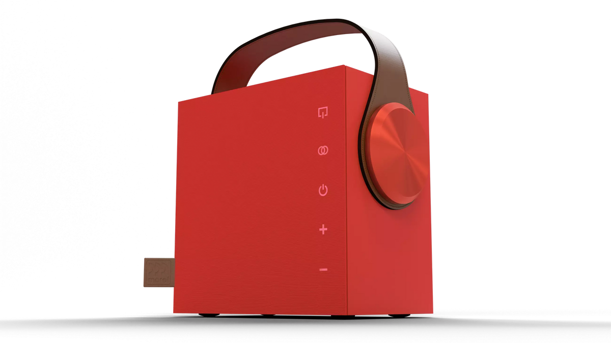 Red portable speaker with brown handle on a white background