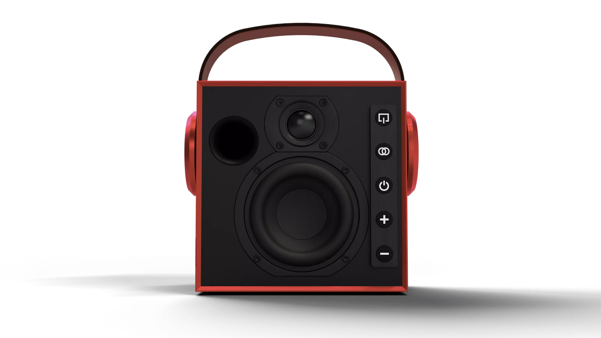 A portable Bluetooth speaker with a black front face, red side panels, and a matching red carrying handle on top, shown against a plain white background.